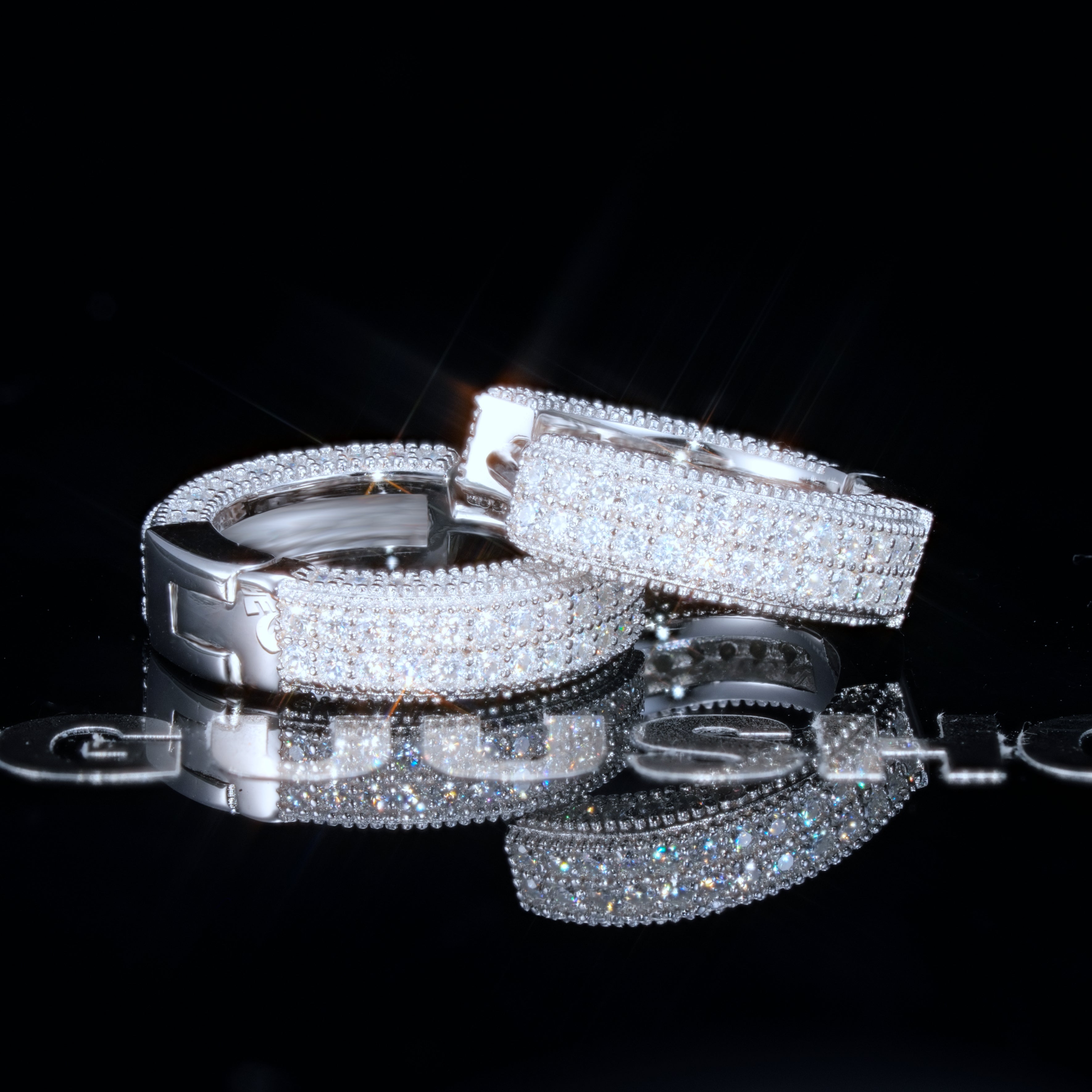 925s VVS1 Moissanite Fully Iced 3D Hoop Earrings In White Gold